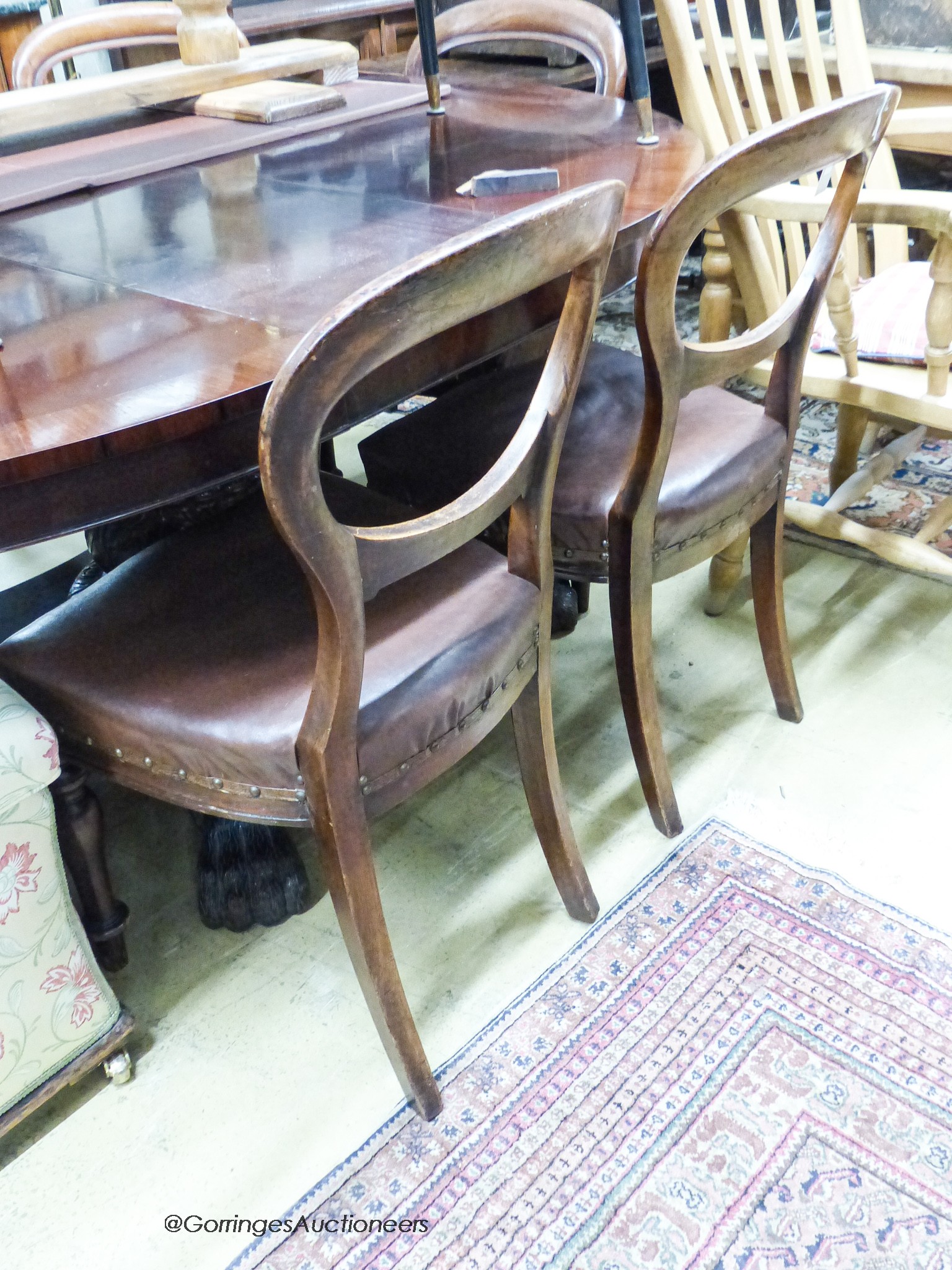 A set of six Victorian mahogany balloon-back dining chairs